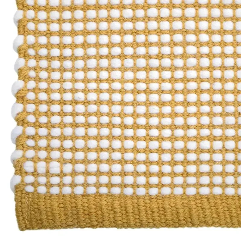Hand-woven wool rug in a vibrant mango color