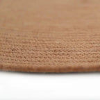 Round rug made of natural wool, handmade in India | understated design