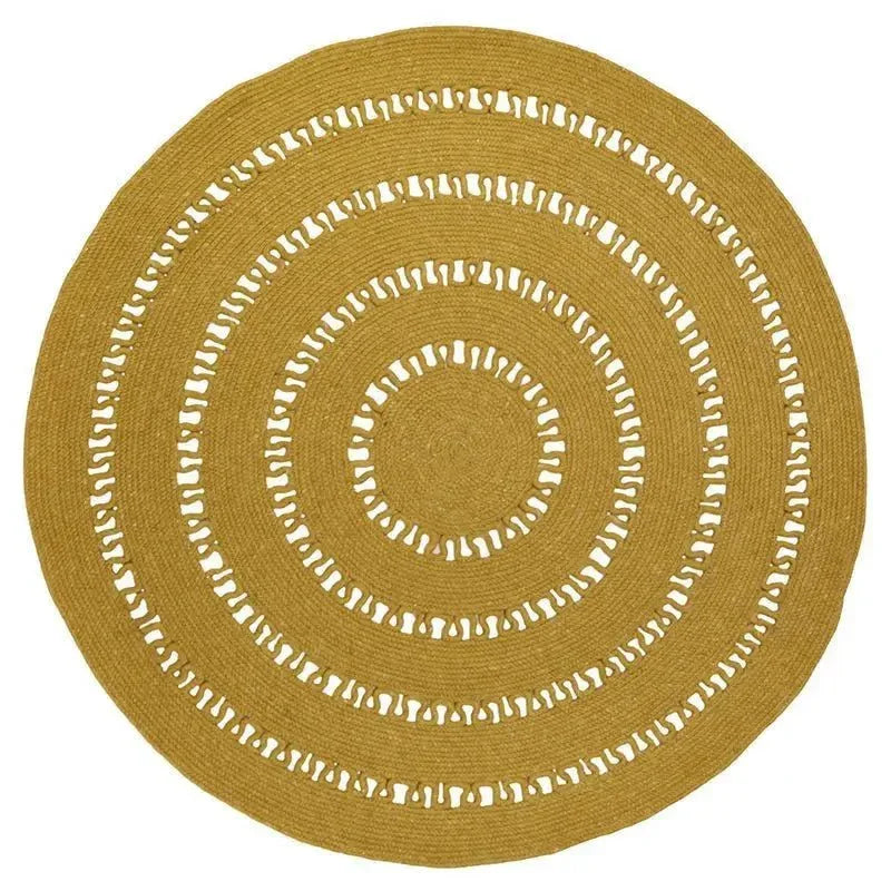 Round handmade wool rug with openwork design