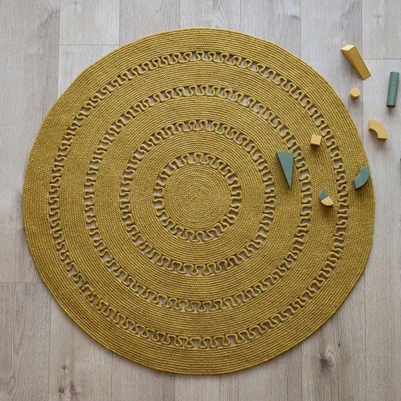 Round handmade wool rug with openwork design