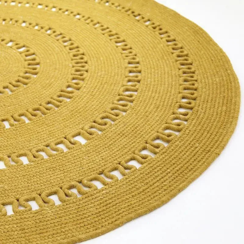 Round handmade wool rug with openwork design