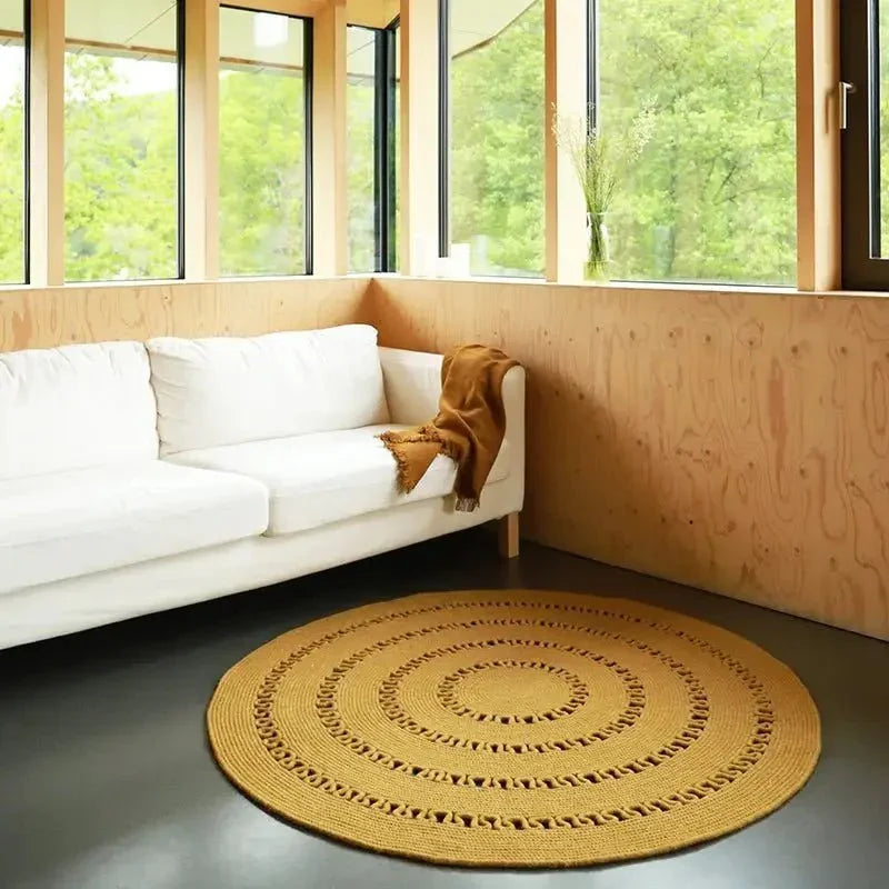 Round handmade wool rug with openwork design