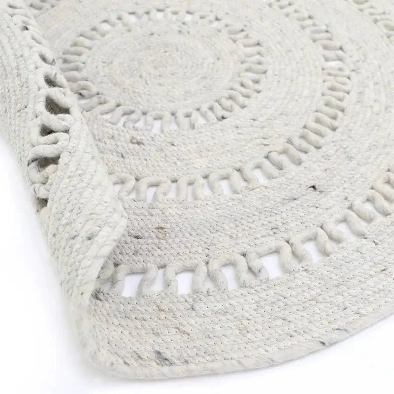 Natural round wool rug handmade in India