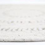Natural round wool rug handmade in India