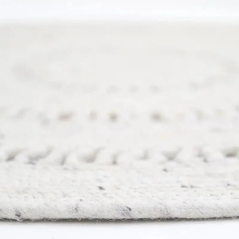 Natural round wool rug handmade in India