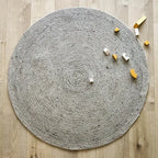 Natural grey wool round rug for indoor use