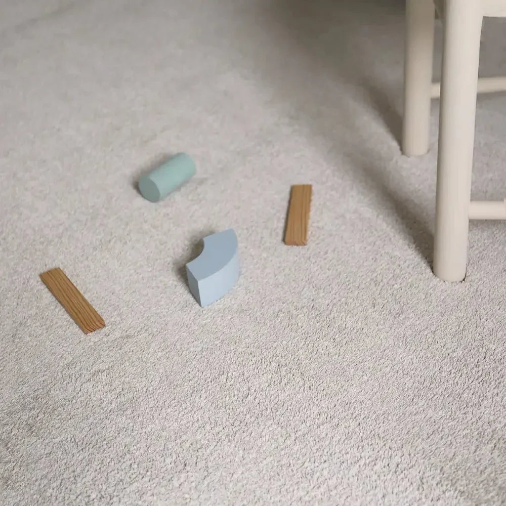 Washable cream-colored short-pile rug